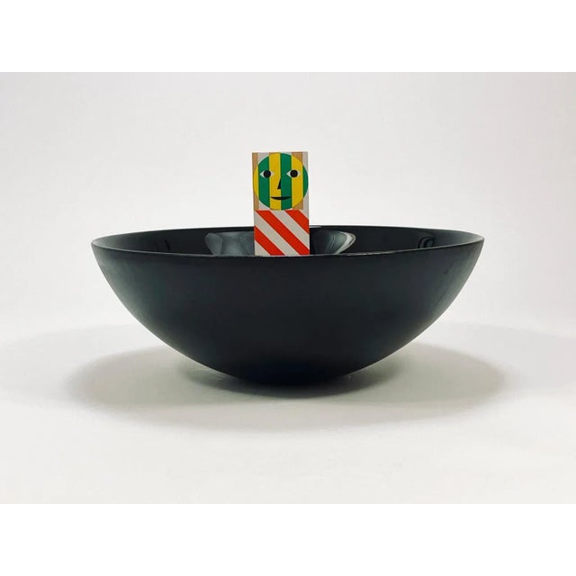 A straight and large, 14 inches diameter postmodern centerpiece glass bowl from the 1980s. Crafted from deep black glass,...