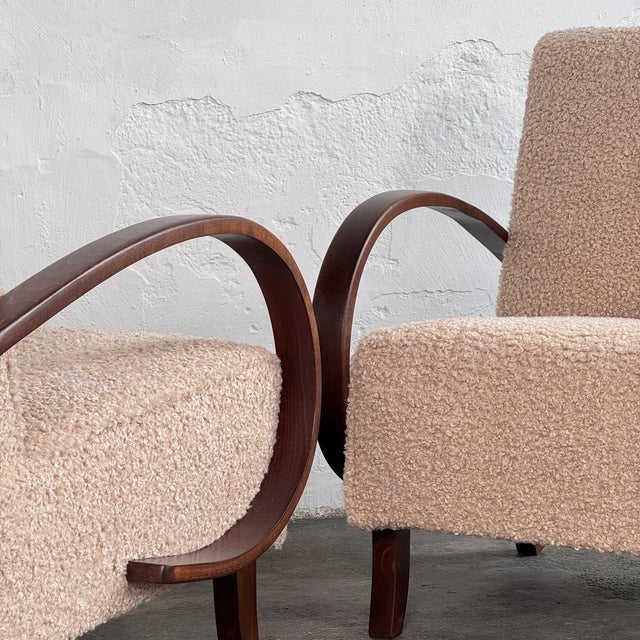This pair of armchairs is based on the iconic type h-410 design by the celebrated czech designer jindrich halabala,...