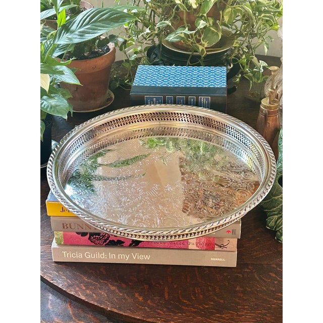 A classic item for any home, this silver plate gallery tray was produced by the Wm Rogers Silver Co. The reticulated sides...