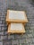 A refined pair of late 20th-century French Louis XVI-style nesting tables, handcrafted in gilded beech wood and topped...