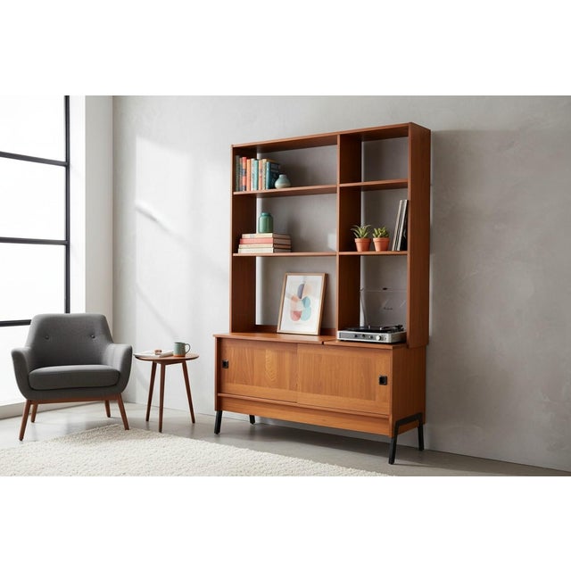 This striking Danish Modern bookcase, crafted circa 1960s, exemplifies the clean lines and functional beauty of mid-...