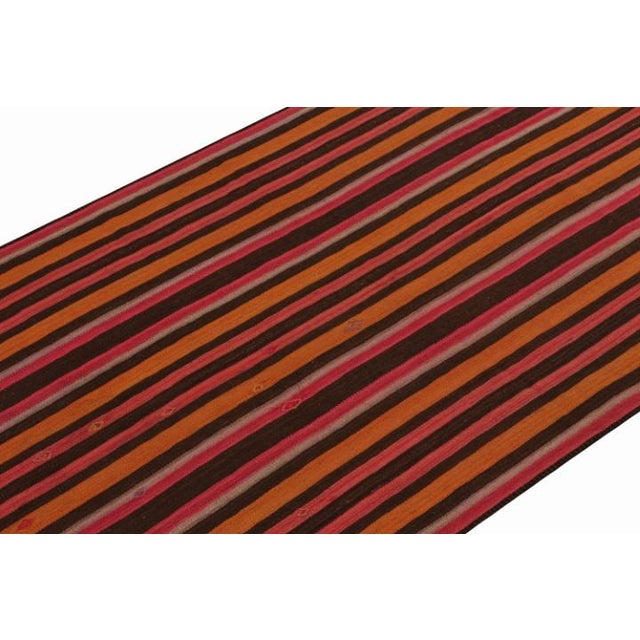 This vintage 5x10 Persian kilim is handwoven in wool, and originates circa 1950-1960. On the Design: This flat weave is...