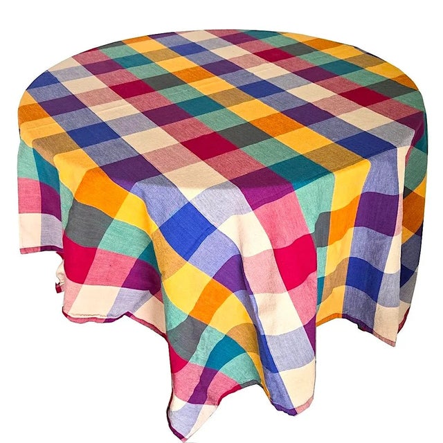 Offered is a set of Dansk multi-colored cotton madras woven table linens including a tablecloth and 6 matching napkins...