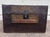 This is an authentic late 19th-century Victorian flat-top travel trunk featuring richly embossed floral tin panels, dark...