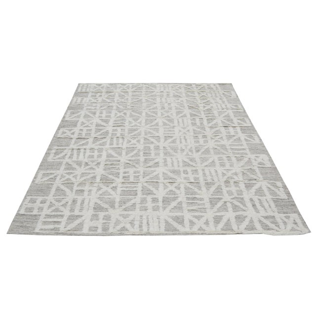 Moroccan Aleph Hand-knotted with care using traditional rug-making techniques, this wool rug blends timeless craftsmanship...