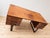 This elegant rosewood desk, designed by Henning Jensen and Torben Valeur, showcases beautiful detailing and solid...