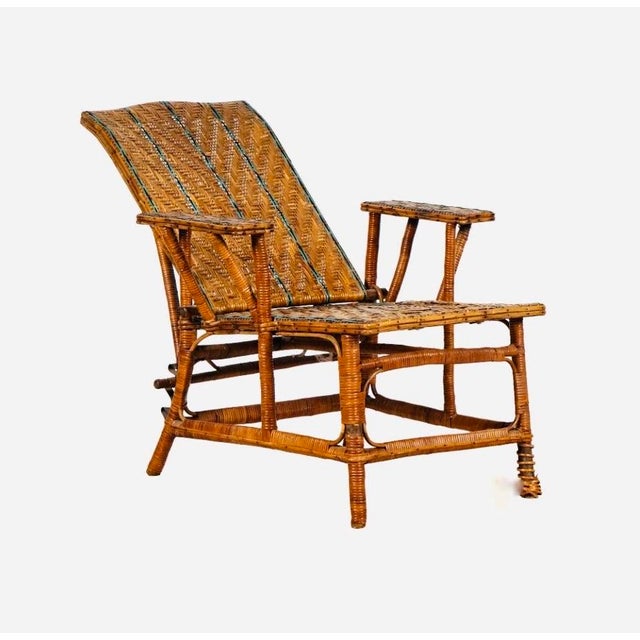 A wonderfully evocative American Bar Harbor-style wicker reclining lounge chair dating to the early 20th century, circa...
