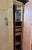 A 2 door birds-eye maple Art Deco style armoire with a fitted interior. Featuring 2 sliding drawers, clothes and tie...