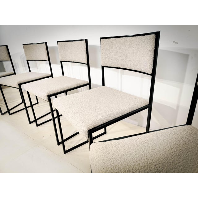 Set of six dining chairs, Italy, 1970s. Black lacquered, reupholstered in beige bouclé fabric. D: 42 cm. H: 77 cm. W: 48 cm.