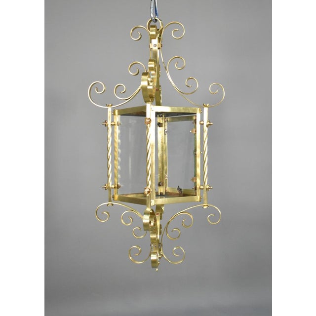 Large French Brass Lantern This large attractive Brass Lantern features an oblong glazed cage with scrolling C scrolls on...