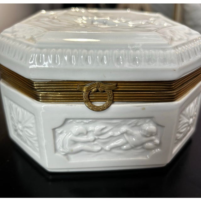 Beautiful antique art deco period French blanc de chine dresser box. Features a woman with two hunting dogs on the lid and...