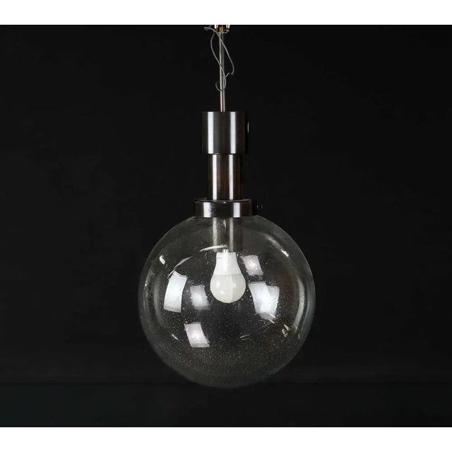 Exquisite pendant lamp crafted in Sweden by Hans-Agne Jakobsson, Markaryd, in the year 1960. These lamps showcase an...