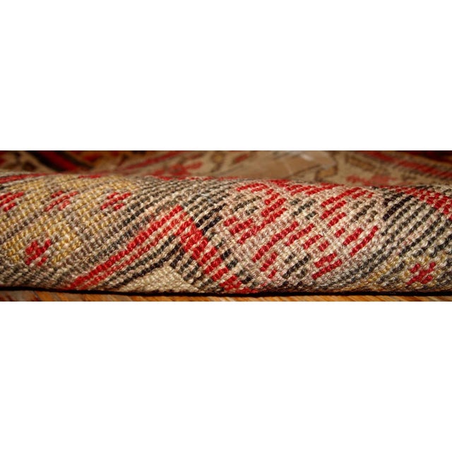 Antique Persian Kurdish rug in yellow, white and red colours. The rug is from the end of 19th century, in good condition....