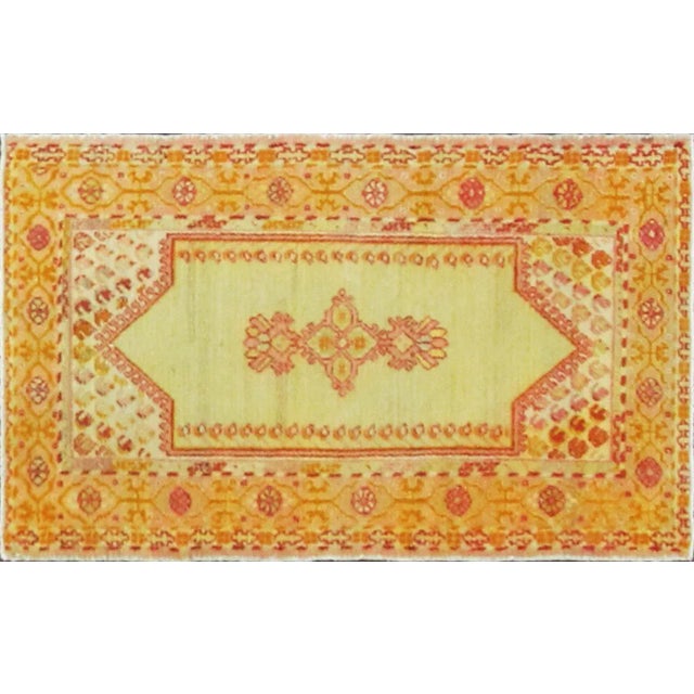 This elegant antique Oushak rug displays the refined simplicity and luminous palette that have made early Anatolian...
