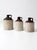 This is a collection of three antique stoneware crock jugs. These antique utilitarian pieces are beautiful statements in...