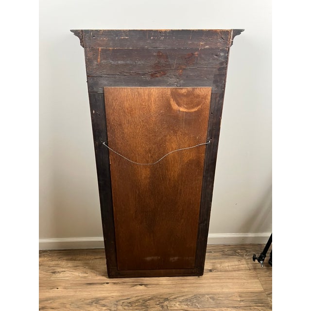 This handsome antique American Empire pier mirror dates to around 1840 and is crafted from richly figured mahogany,...