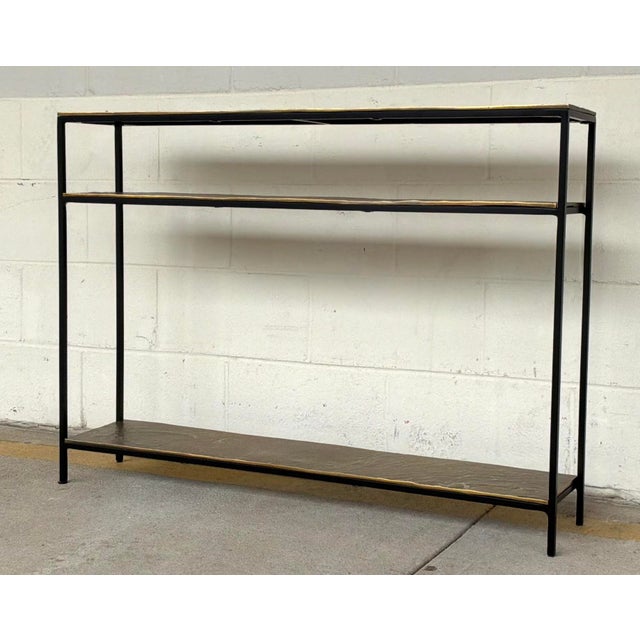 Original retail $2310, stylish Currey and Company Modern Brass Lathi Console Table, black metal frame, showroom floor sample