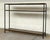 Original retail $2310, stylish Currey and Company Modern Brass Lathi Console Table, black metal frame, showroom floor sample