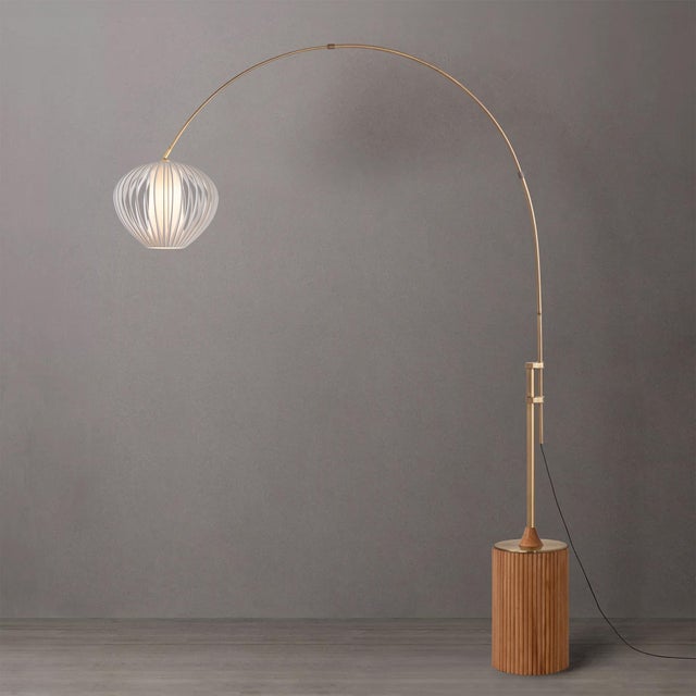 The Tambo Arc Lamp is a sophisticated lighting solution that blends modern design with a touch of classic elegance....