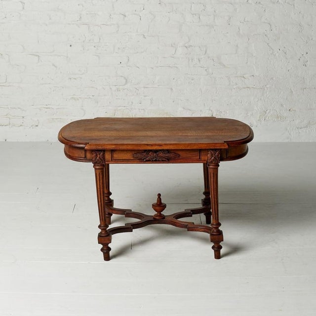 This Early 20th Century French Louis XVI style coffee table blends refined neoclassical elegance with rustic European...