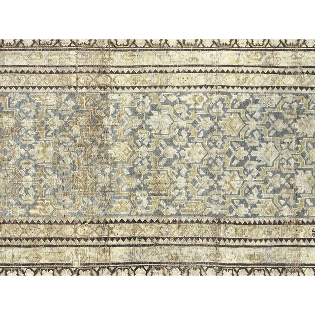 This beautifully hand-knitted Antique Persian Melayer Runner is crafted with an intricate and classic design. With...