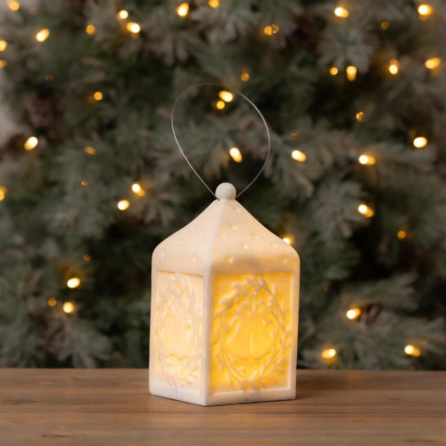 Add a warm, festive glow to your holiday decor with the LED Holiday Bell Lantern. Designed with a timeless bell shape and...