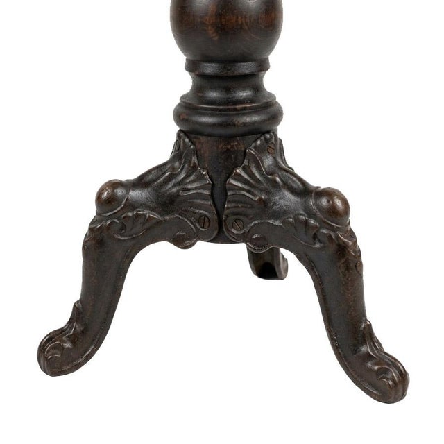 Turn of the century Victorian adjustable height piano stool with cast iron feet and miraculously-good-condition...