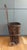 Antique rustic bentwood basket shopping cart featuring vertical wood slat body, wooden wheels and a wood handle....