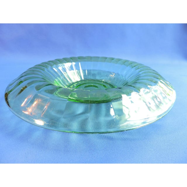 This antique depression Vaseline glass rolled rim console centerpiece bowl was made by the Anchor Hocking Glass Co. and it...