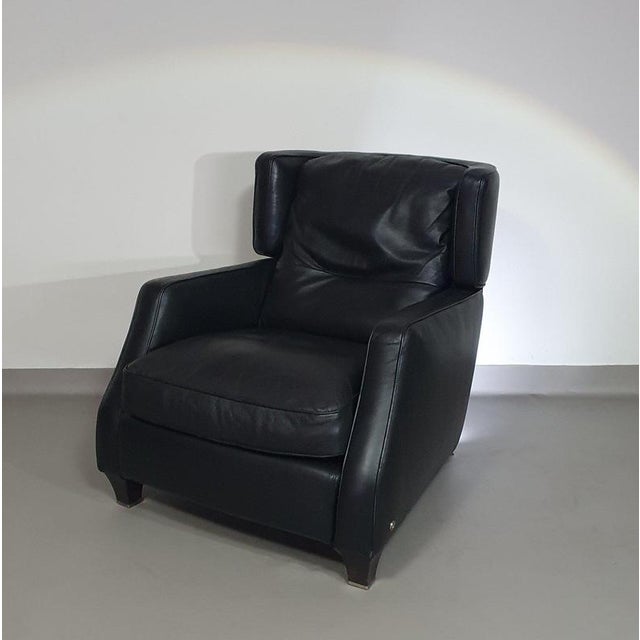 Amadeus natuzzi lounge chair / black leather classic style armchair, with a slightly open base, amadeus has a winding...