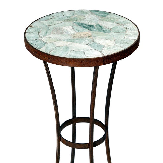 This simple iron plant stand features a mosaic slate top securely set within an iron frame, ensuring the piece is robust...