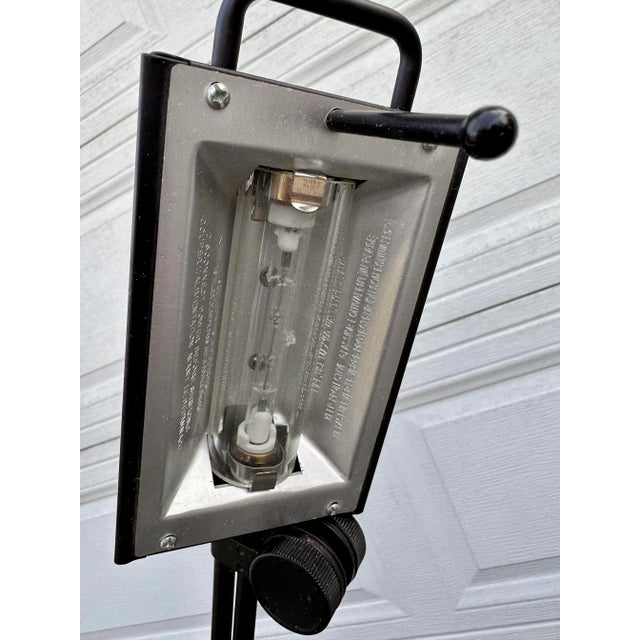 Vintage freestanding task lamp in matte black. Features two knobs that adjust the angle of the arm. The shade rotates as...