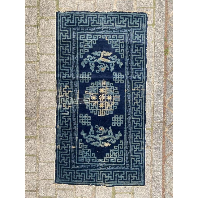 Exquisite small Chinese rug from late 19th century Beijing. Hand-knotted with wool on cotton, this rug features a stunning...