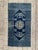 Exquisite small Chinese rug from late 19th century Beijing. Hand-knotted with wool on cotton, this rug features a stunning...