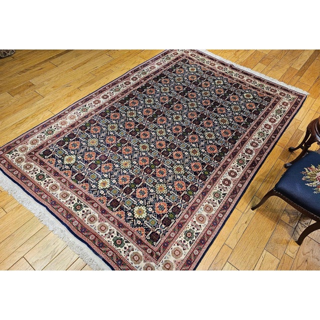 Vintage room size Tabriz Afshan in a rare and highly desirable all over geometric Caucasian Kuba pattern. The beautiful...