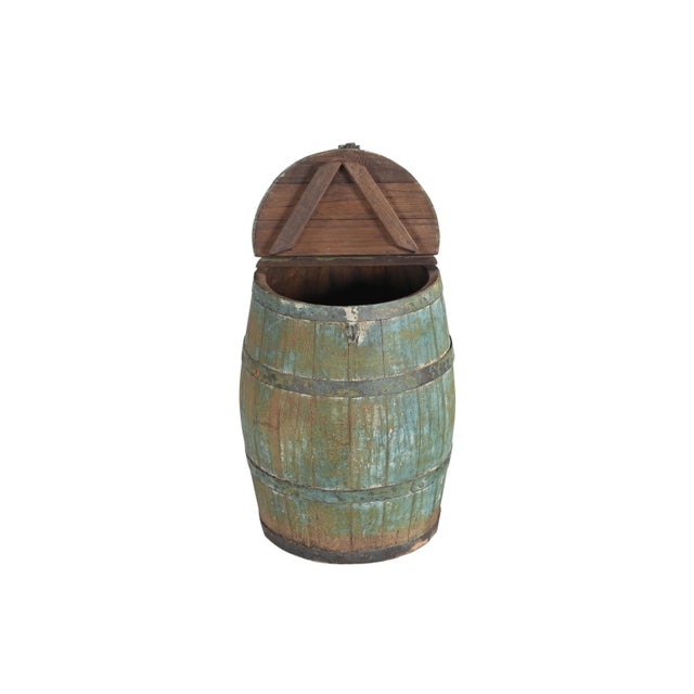This Vintage Indian Painted Barrel with Lid Added is a charming and versatile piece that celebrates the character of...