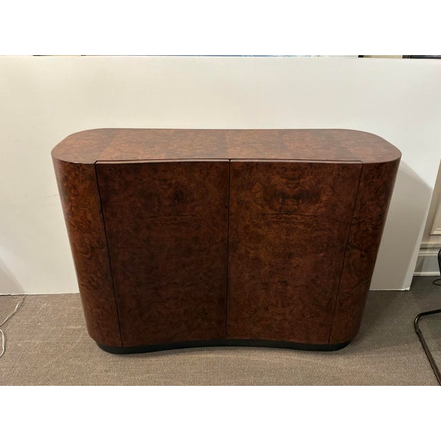 Stylish Baker Cachou Burl Wood Chest. Brown burl wood. 1 drawer, 4 shelves, 2 doors. Original Retail $8000. Showroom floor...