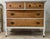 Beautiful vintage solid wood dresser featuring a graceful curved front, warm natural wood drawer fronts, and a white...