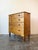 A charming scalloped front English antique chest of drawers with a useful configuration of two small drawers above three...