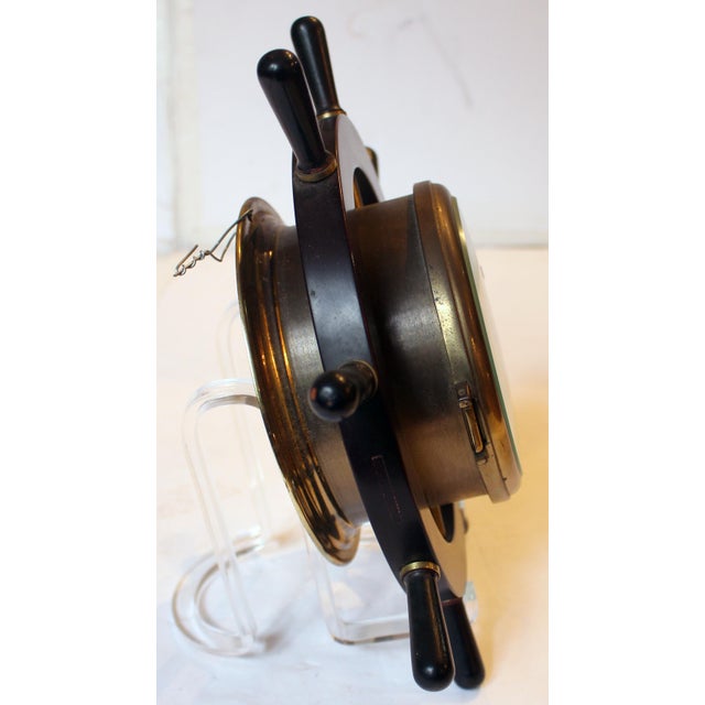 Mid-20th century ship's clock by Schatz, Germany. handsome brass, mahogany & ebony in the form of a ship's wheel. Beveled...