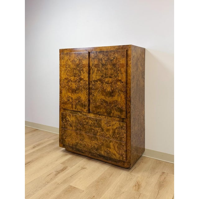 This vintage tallboy armoire by John Stuart Inc. is a genuinely collectible example of mid-century modern craftsmanship,...