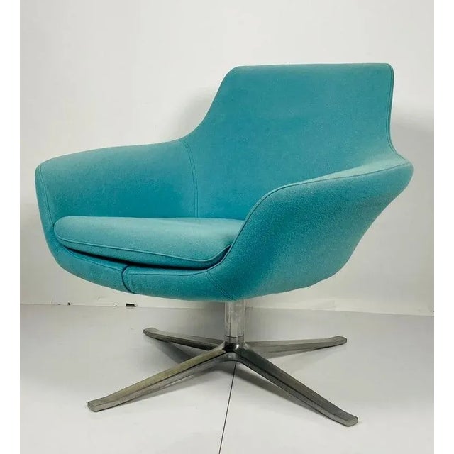 A well-crafted beauty. With flared arms, a matte polished aluminum base and a very comfortable feel, the Bob Lounge chair...