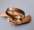 Set of eight solid brass napkin rings. In the shape of a rose floral with leaves on both ends. Nice weight and very good...