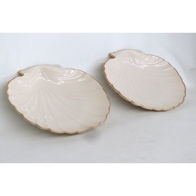 This beautiful Pair of 2 Dishes are made of ivory porcelain. These pieces are both stamped on the bottom as having been...