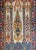 A beautiful mid-20th century Persian Isfahan prayer rug with an architectural elements like columns, chandeliers, and...