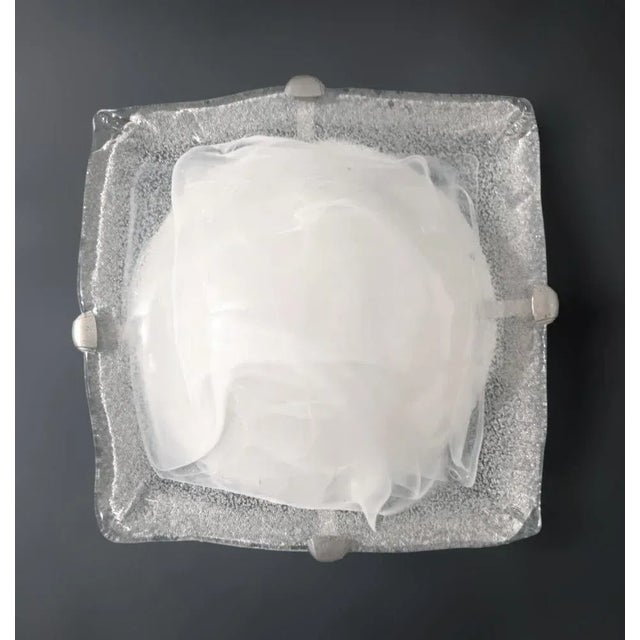 Vintage Italian flush mount or wall light with a single square graniglia Murano glass shade in milky white color / Made in...