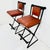 Handsome, sturdy pair of vintage bar stools in the style of Cleo Baldon. Featuring a wrought iron framework in black...