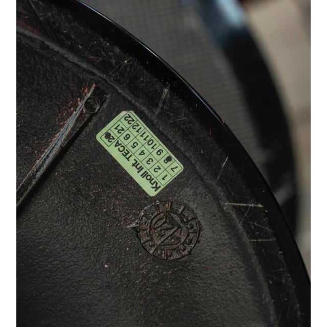 Eero saarinen (1910-1961), knoll edition: "marquina" black circular marble pedestal table, aluminum base covered with...