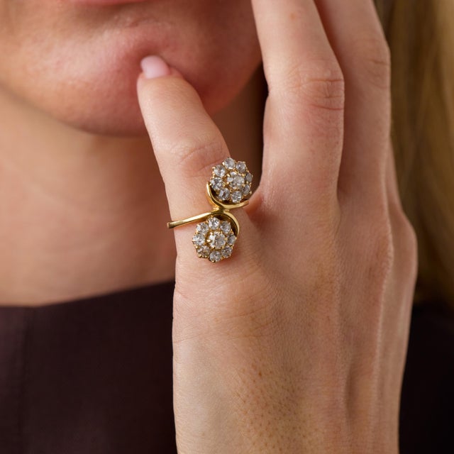 This striking vintage diamond bypass ring is a beautifully sculptural design from the 1970’s, featuring 2 principal old...