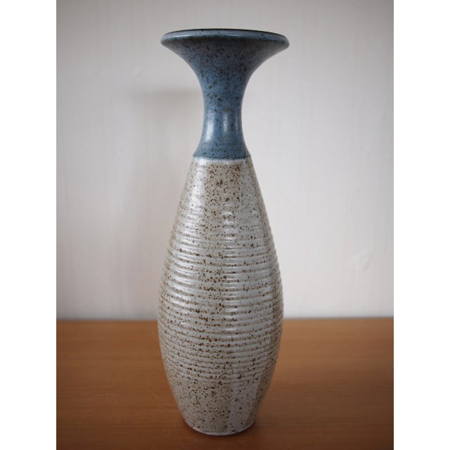 Large and heavy floor vase signed KIRK; ribbed design with speckles. Approximate dimensions: 19" high, 6.5" wide...